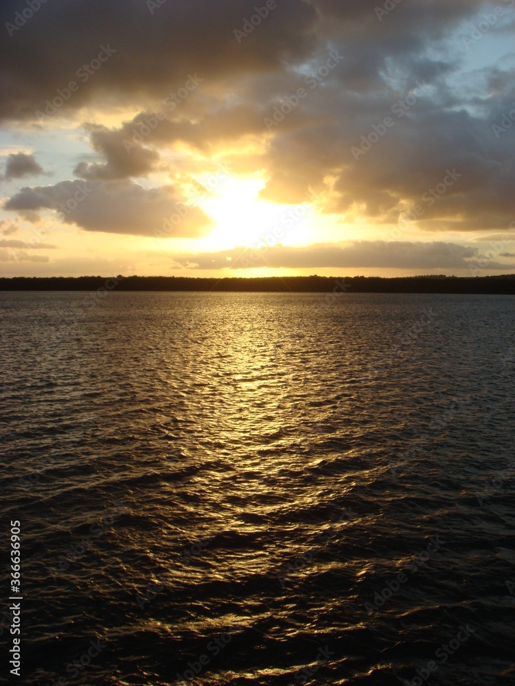 Obraz premium sunset over the river