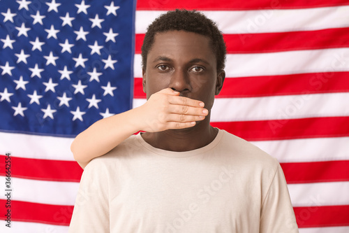 Person covering mouth of sa...