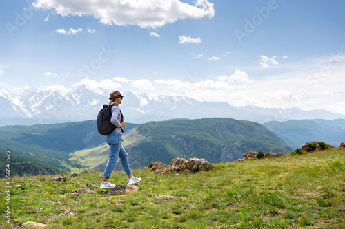 Woman with backpack hiking Lifestyle adventure concept. Copy space.