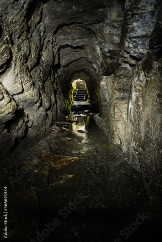 An old sluice tunnel used during the gold rush and mining in Franz Josef New Zealand