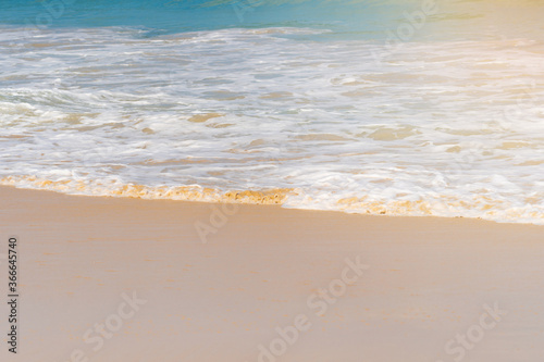 Seawater wave on sandy beach