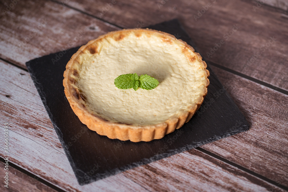 A top view of a delicious tart with mint on top