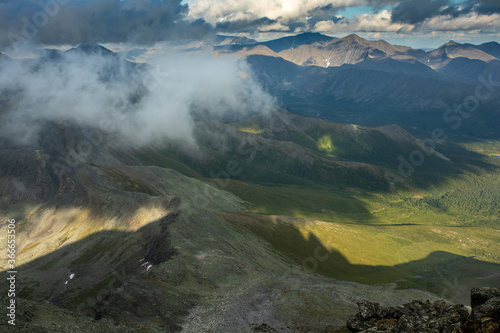 Amazing mountain landscape with colorful sky. Travel and hiking concept. Mountain landscape Subpolar Ural view from Mount Manaraga. Queen of the Ural Mountains. photo