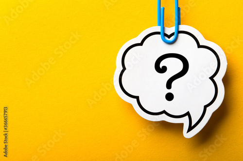 Question Mark Speech Bubble Isolated On Yellow Background photo