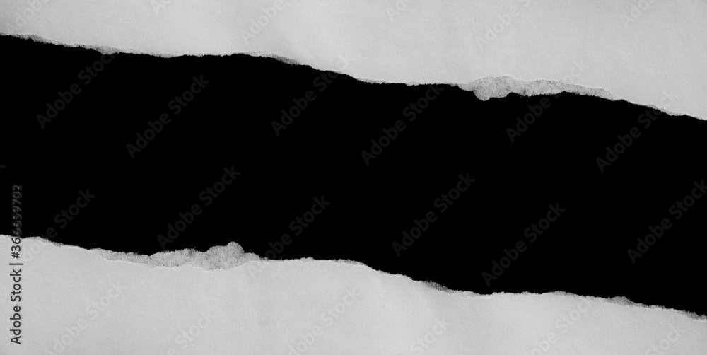 Ripped paper on black background, space for advertising copy. Ripped paper on black background, space for advertising copy.