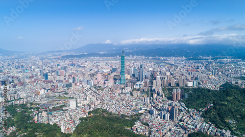 Taipei City Aerial View - Asia business concept image, panoramic modern cityscape building bird’s eye view in morning blue bright sky. Drone photography shot in Taipei, Taiwan. © YUSHENG HSU