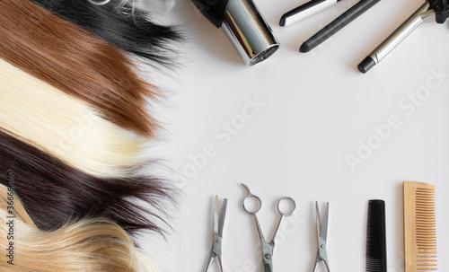 Care for different types of hair and hair color: blond, red, brown, dark, straight and curly hair. Concept of a beauty salon. Tools for hair care, hair.