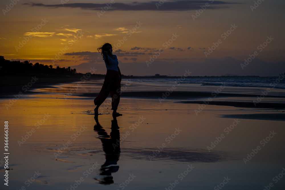 Beautiful silhouette image of Kids playing and enjoying at the Beach in Costa Rica