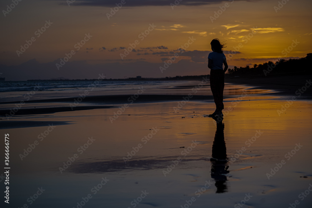 Beautiful silhouette image of Kids playing and enjoying at the Beach in Costa Rica