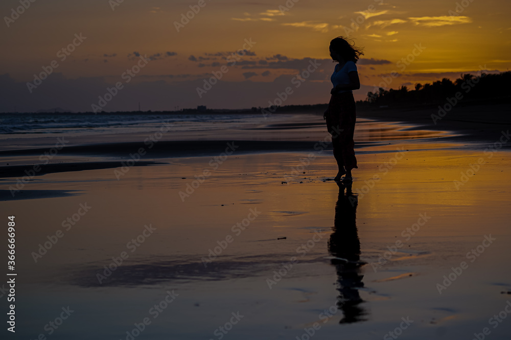 Beautiful silhouette image of Kids playing and enjoying at the Beach in Costa Rica Beautiful silhouette image of Kids playing and enjoying at the Beach in Costa Rica