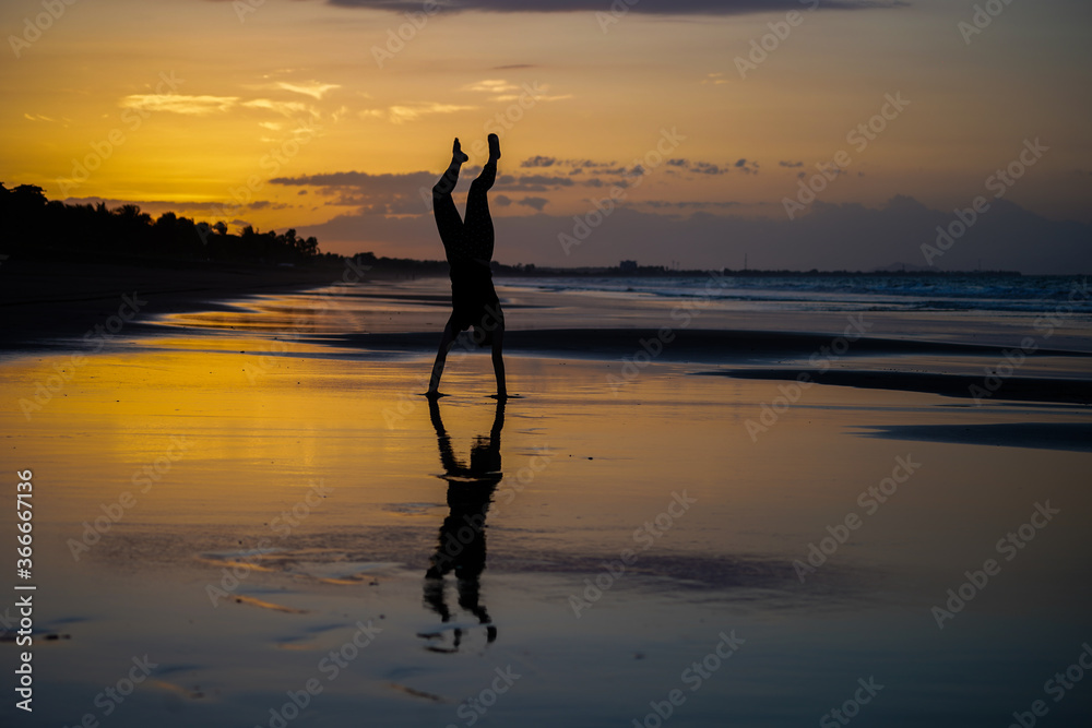 Beautiful silhouette image of Kids playing and enjoying at the Beach in Costa Rica Beautiful silhouette image of Kids playing and enjoying at the Beach in Costa Rica