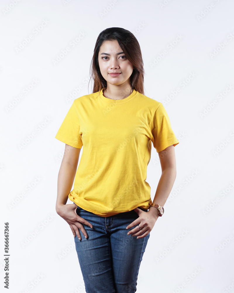 Front view yellow t-shirt Closeup on female body, woman girl in empty yellow t-shirt isolated on white background. Design woman t-shirt template and mockup for print.