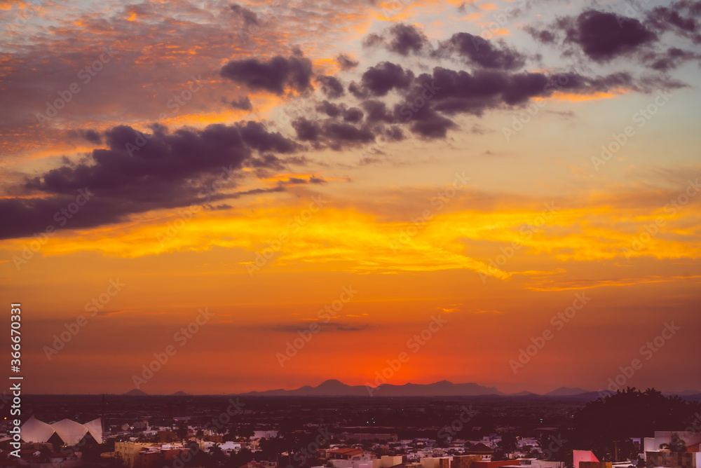 beautiful sunset with cloudy skies over the city and mountains beautiful sunset with cloudy skies over the city and mountains