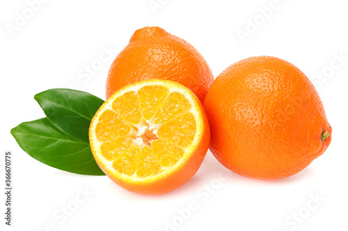 Orange clementine or minneola tangelo with slices and green leaves isolated on white background. Tangerine. Citrus fruit.