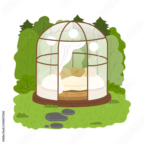 Glass transparent glamping house with bedroom inside surrounded by green forest