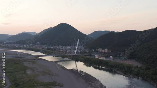 Suspension bridge over Nagaragawa river in Gifu, Early morning aerial shot photo