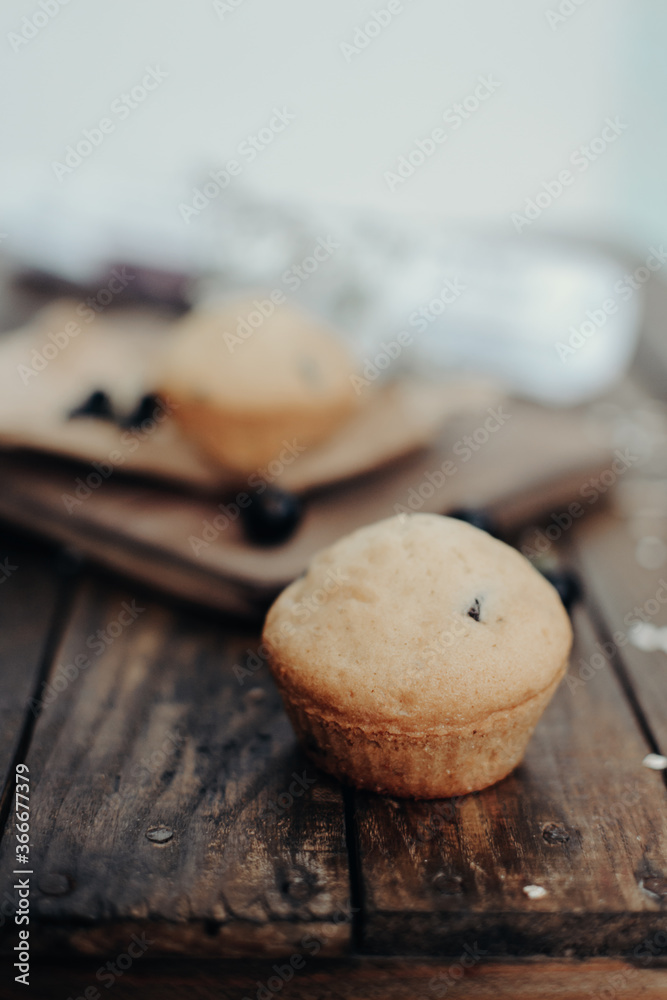 The tasty muffins with chocolate on a wooden desk. Muffins for perfect and beautiful breakfast. 