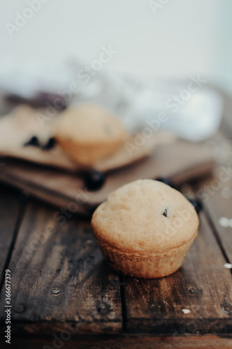 The tasty muffins with chocolate on a wooden desk. Muffins for perfect and beautiful breakfast. 