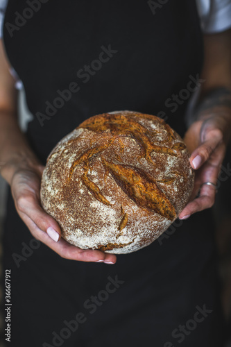 man holding bread in his hands