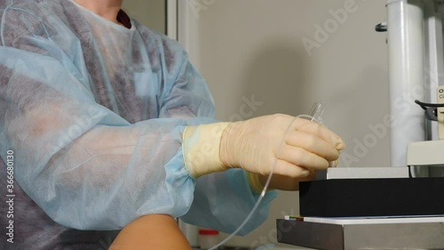 Ivf follicular puncture, female assistant doctor holding empty test tube for oocyte retrieved, nurse redy to pass plastic vial for pink media liquid, egg retrieval procedure. 4 k video