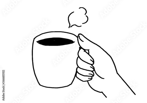 温かい湯気が立ち上るコーヒーを持つ男性もしくは女性の右手