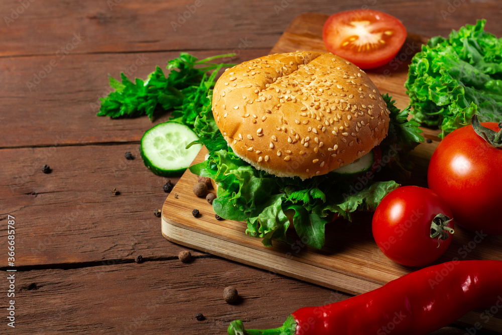 Cooking burger on a dark wooden background. Diet, no meat Cooking burger on a dark wooden background. Diet, no meat