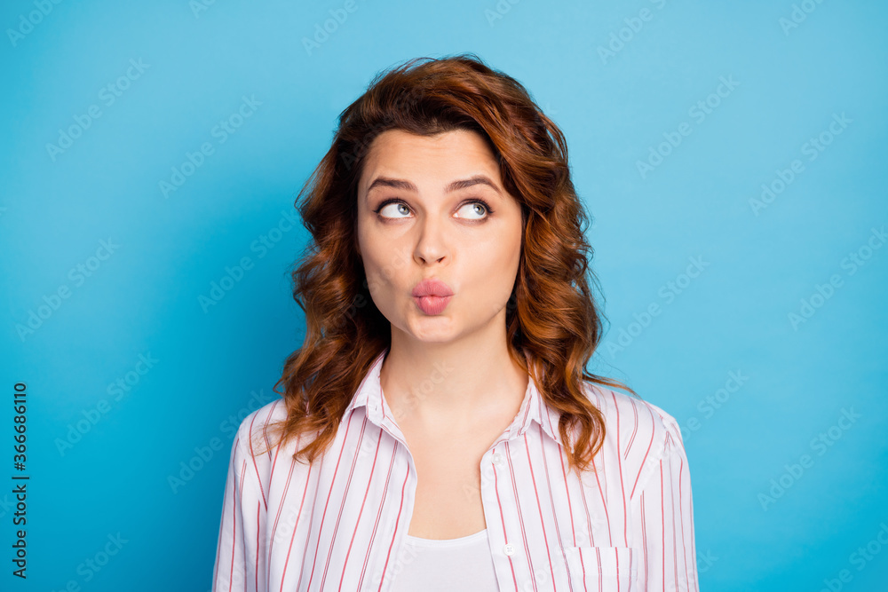 Close-up portrait of her she nice-looking attractive lovely cute wavy-haired girl pout lips looking aside guessing isolated on bright vivid shine vibrant blue color background Close-up portrait of her she nice-looking attractive lovely cute wavy-haired girl pout lips looking aside guessing isolated on bright vivid shine vibrant blue color background