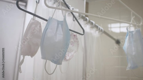 Hang drying protective face masks during the early stages of the Coronavirus pandemic when there was a shortage of masks and washing and re-using them was encouraged.  photo