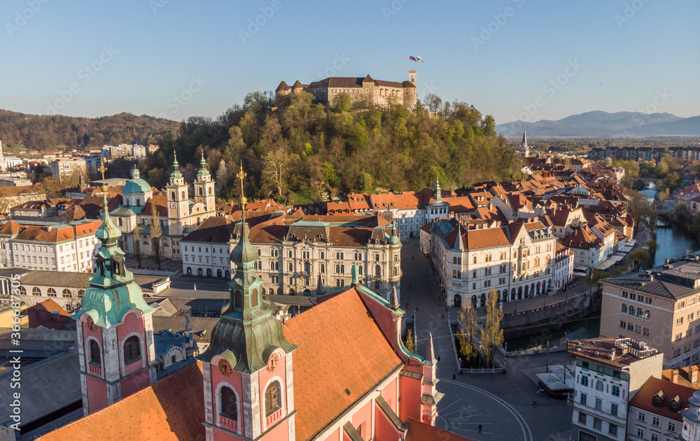 Aerial drone panoramic view of Ljubljana, capital of Slovenia in warm afternoon sun.