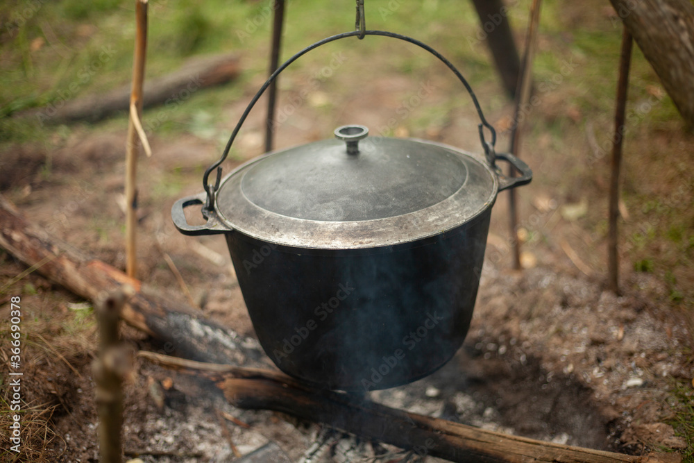 Boiler on the fire. Cooking boiler for camping. Boiler on the fire. Cooking boiler for camping.