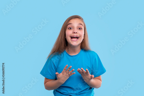 Obraz na plátně Teenager girl wants to be heard, and therefore speaks loudly about something, ge