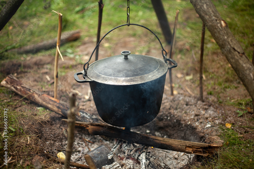 Boiler on the fire. Cooking boiler for camping. Boiler on the fire. Cooking boiler for camping.