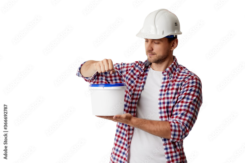 caucasian handyman worker in plaid shirt and hard hat holding paint bucket. builder or painter decorator isolated on white background caucasian handyman worker in plaid shirt and hard hat holding paint bucket. builder or painter decorator isolated on white background