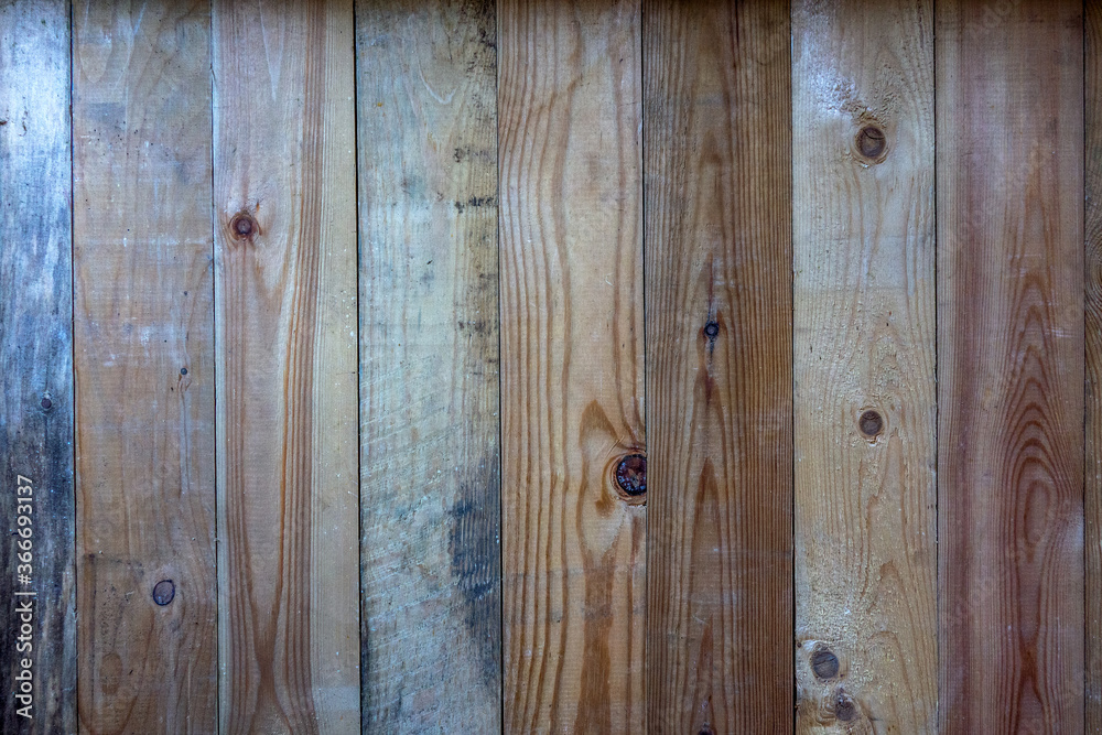 Fototapeta premium Texture of fresh boards with vertical lines, wall in a garden house.