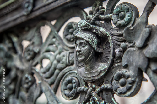 Bronze high reliefs on the fence of the Duomo in the city of Bergamo. Lombardy, Italy