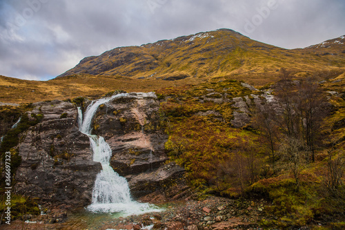 Scottish landscape with a waterfall in the foreground