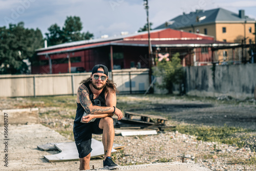 tattooed guy in urban environment 