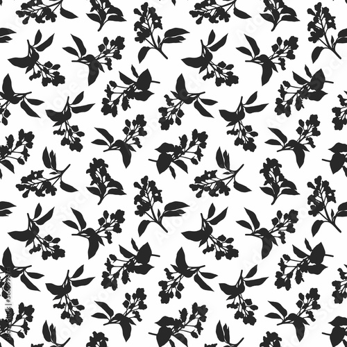 Contrasting black and white botanical print. Abstract seamless pattern with silhouettes of flowering twigs.