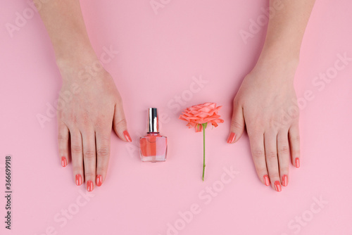 Coral nails and rose bud. Chosen lacquer matching with color of flower