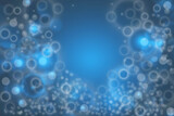 Abstract blurred festive delicate winter christmas or Happy New Year background with shiny blue and white bokeh lighted circles andbubbles. Space for your design. Card concept.