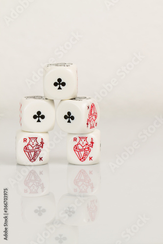 Full House, Aces and Kings Playing Casino poker dice closeup Isolated on white background with reflection. Abstract Pattern