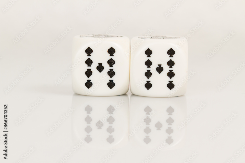 Two Nines Playing Casino poker dice closeup Isolated on white background with reflection. Abstract Pattern Two Nines Playing Casino poker dice closeup Isolated on white background with reflection. Abstract Pattern