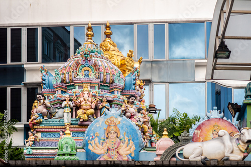 Sri Veeramakaliamman Temple dedicated to the Hindu goddess Kali, with richly decorated carved colorful roof with Hindu Gods and statues in Little India district in Singapore. photo