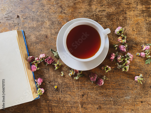white cup of tea on a wooden table