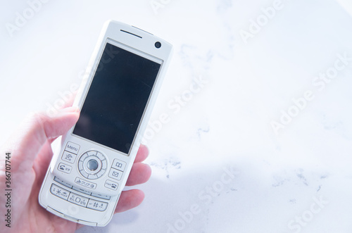 2000年代のスライド型携帯電話。日本のガラケー。 photo