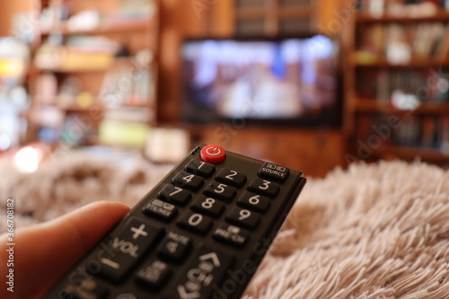 tv remote control in hand