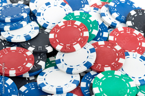 Playing Poker Chips laying on the table mixed together. Abstract Pattern Background