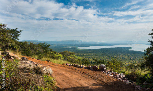 Landscape with road in the Akagera National Park, Rwanda, Africa photo