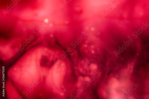 abstract blurred red background with swirls and waves  defocused background