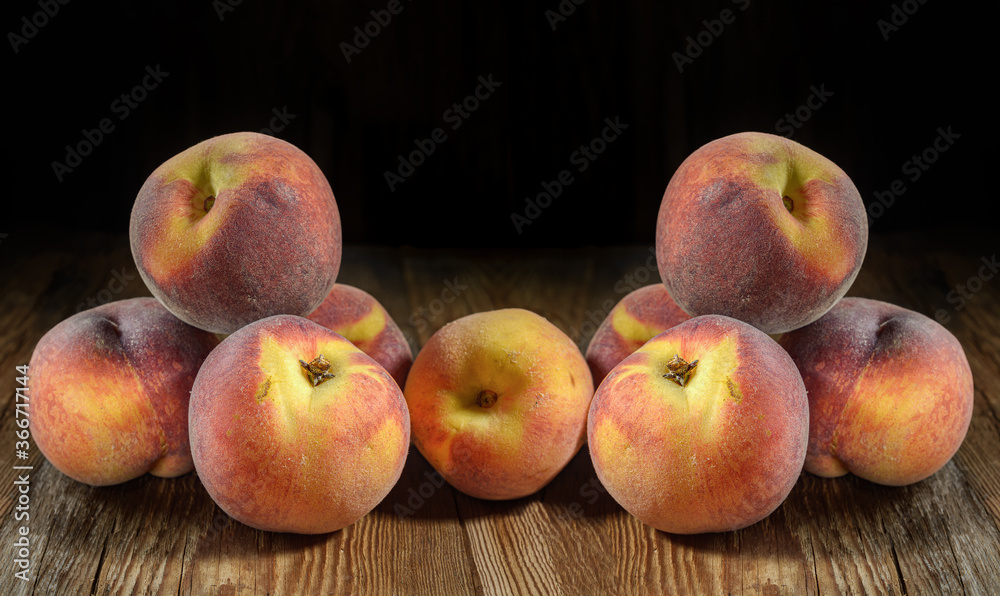 ripe peaches close-up on a dark wooden rustic background, horizontal view ripe peaches close-up on a dark wooden rustic background, horizontal view